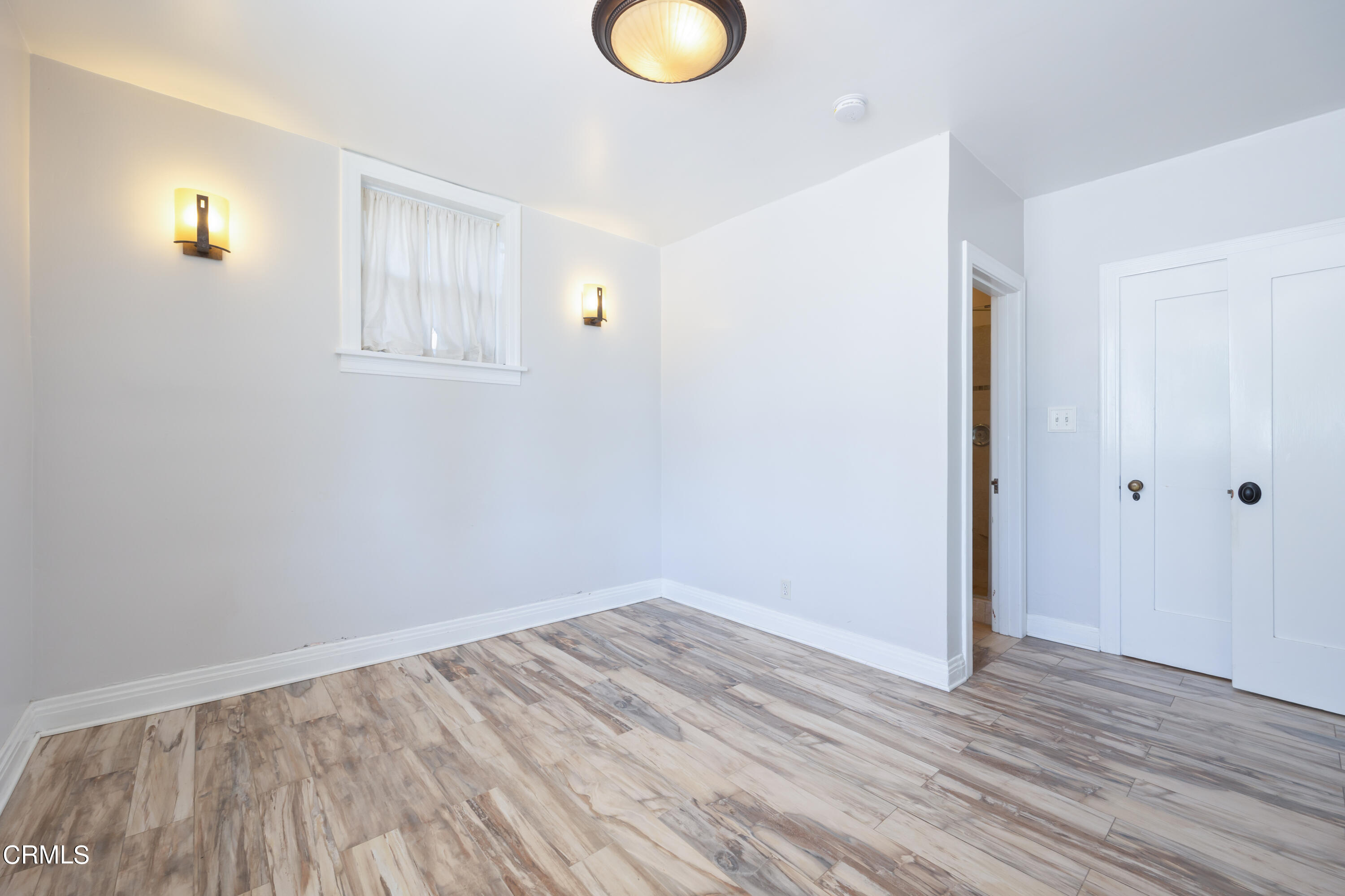 430 West Kenneth Road Glendale, CA 91202 - Photo 44 of 73 an empty room with wooden floor and windows