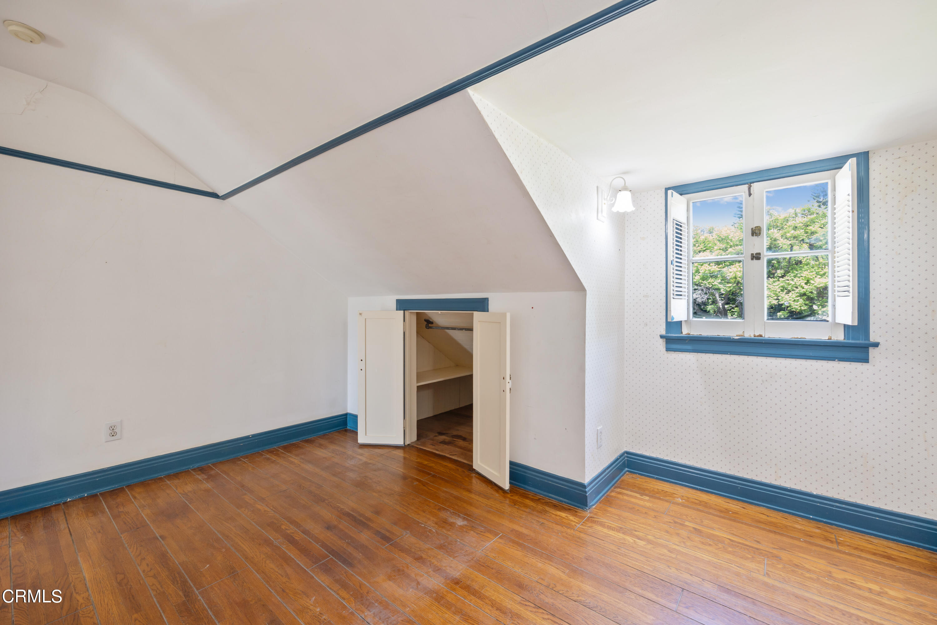 430 West Kenneth Road Glendale, CA 91202 - Photo 57 of 73 a view of an empty room with wooden floor and a window