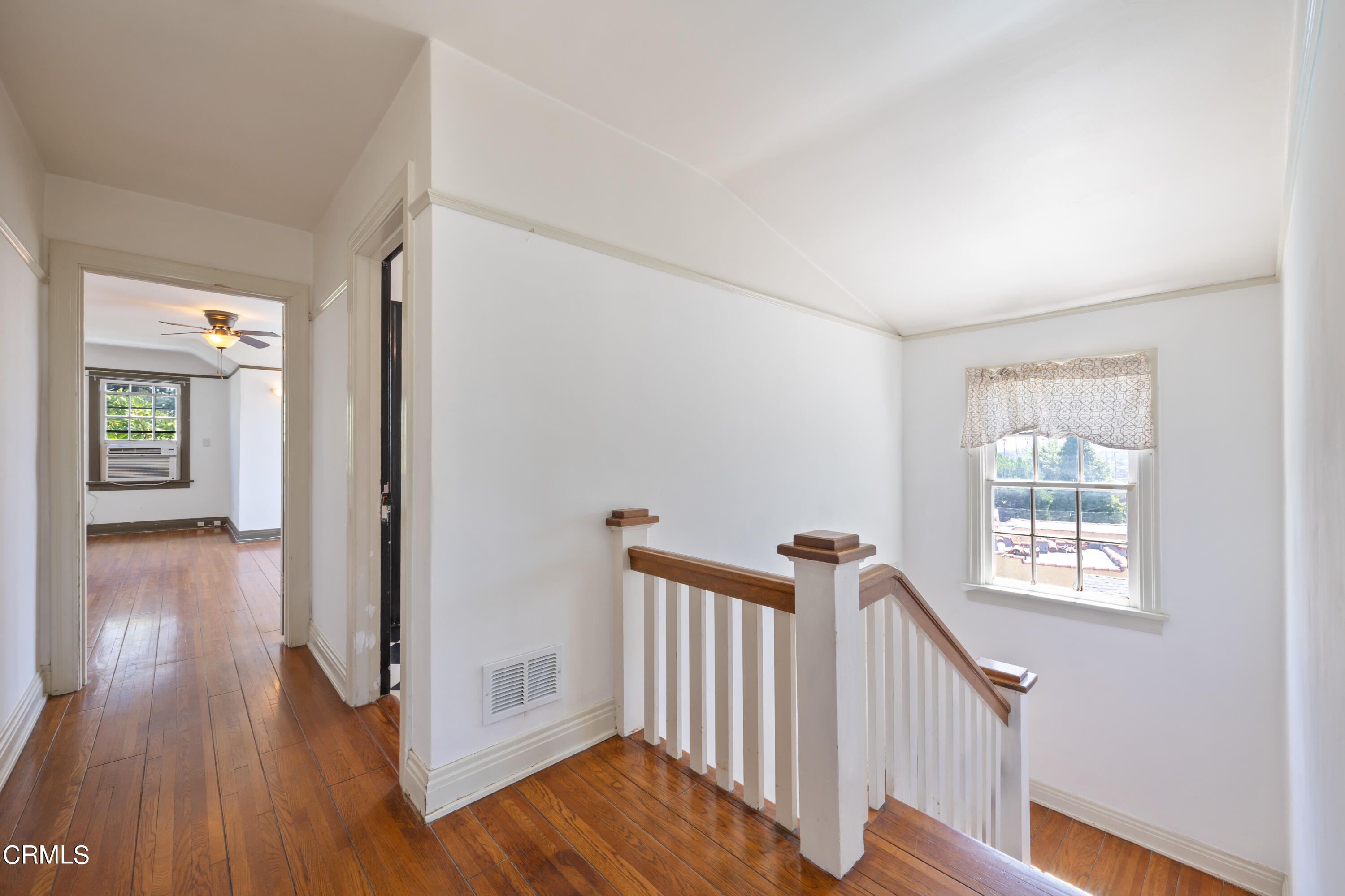 430 West Kenneth Road Glendale, CA 91202 - Photo 59 of 73 a view of a hallway with wooden floor and stairs