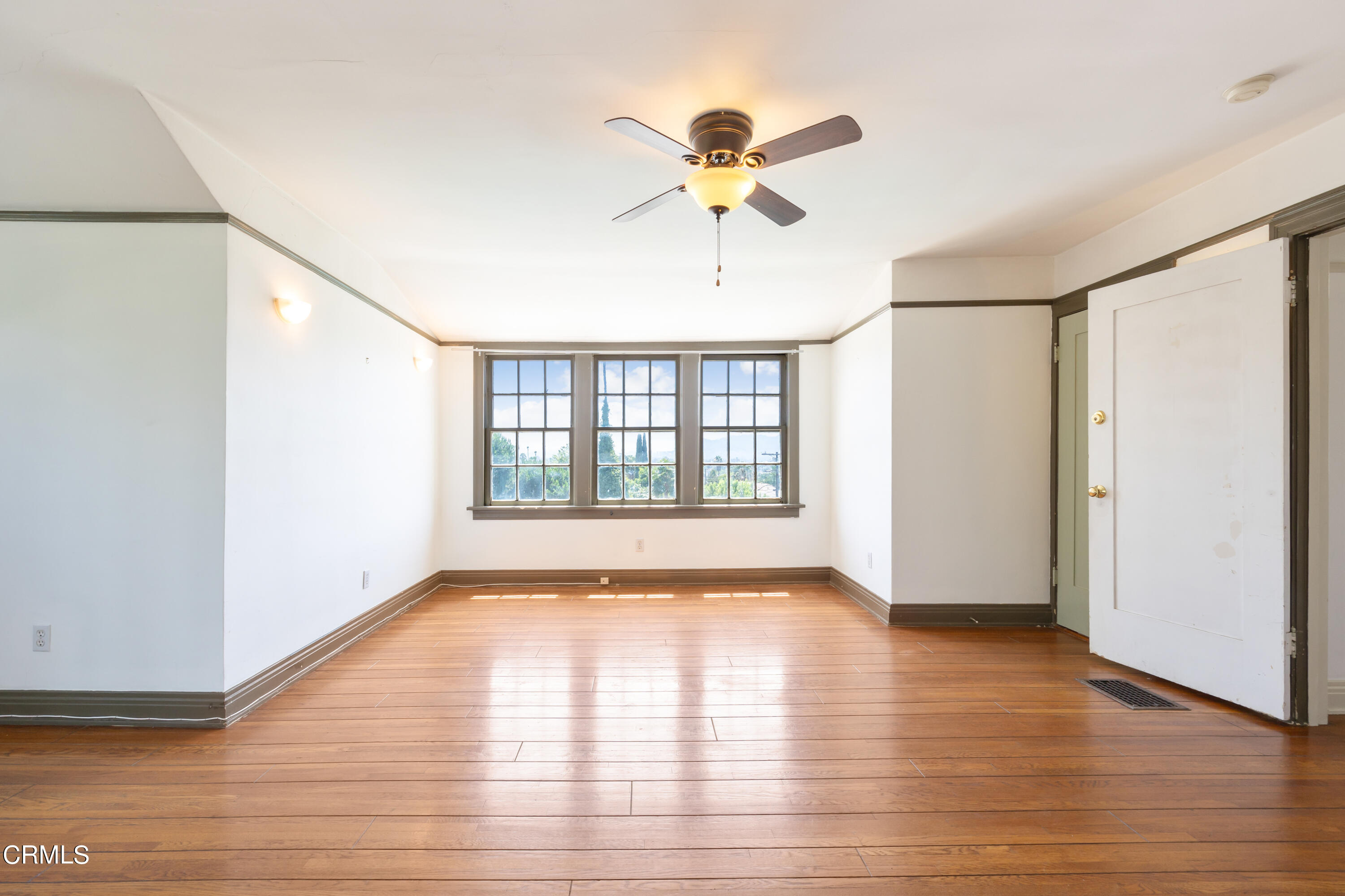 430 West Kenneth Road Glendale, CA 91202 - Photo 63 of 73 a view of an empty room with wooden floor and a window