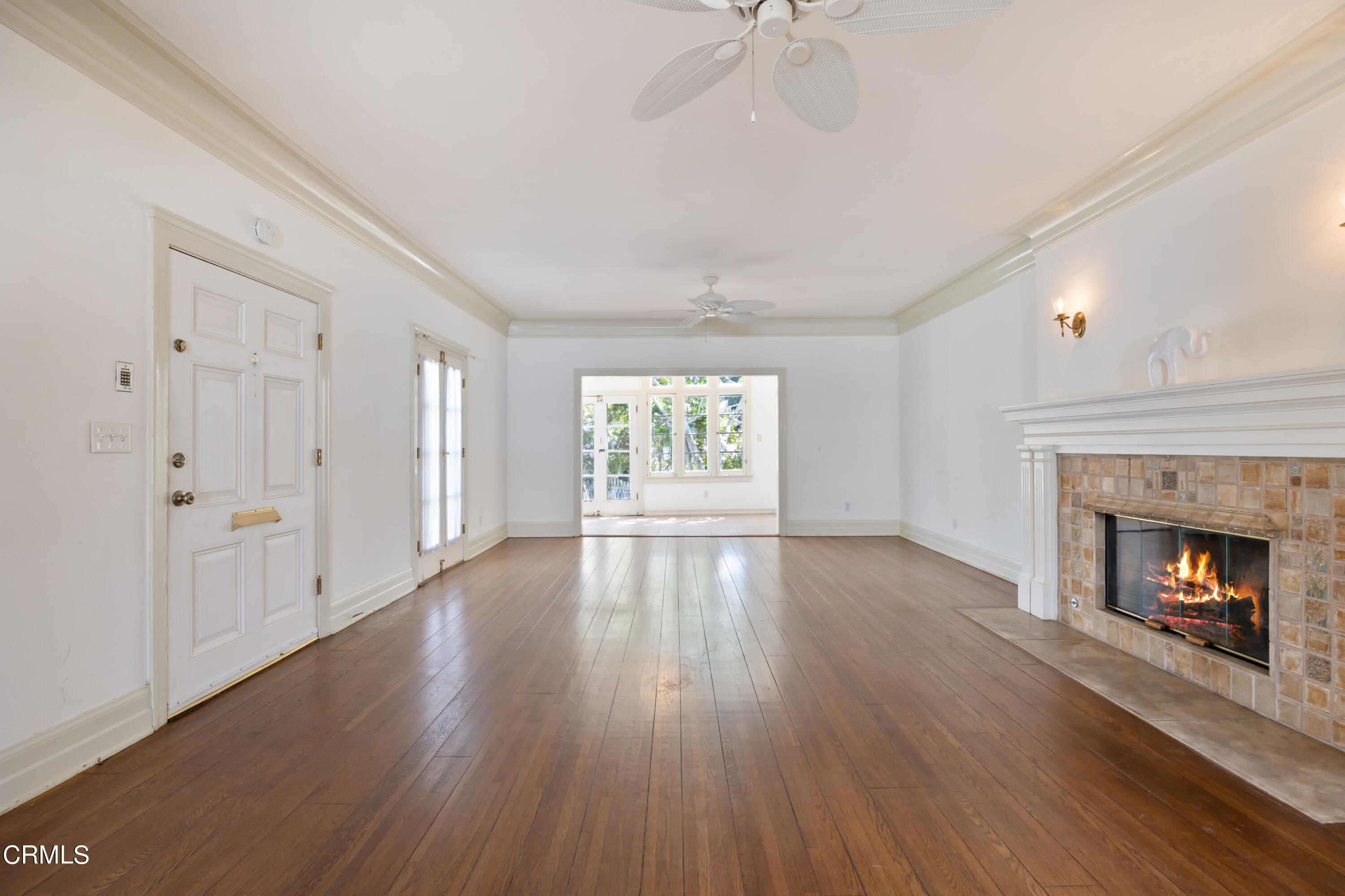 430 West Kenneth Road Glendale, CA 91202 - Photo 7 of 73 a view of an empty room with wooden floor and a window