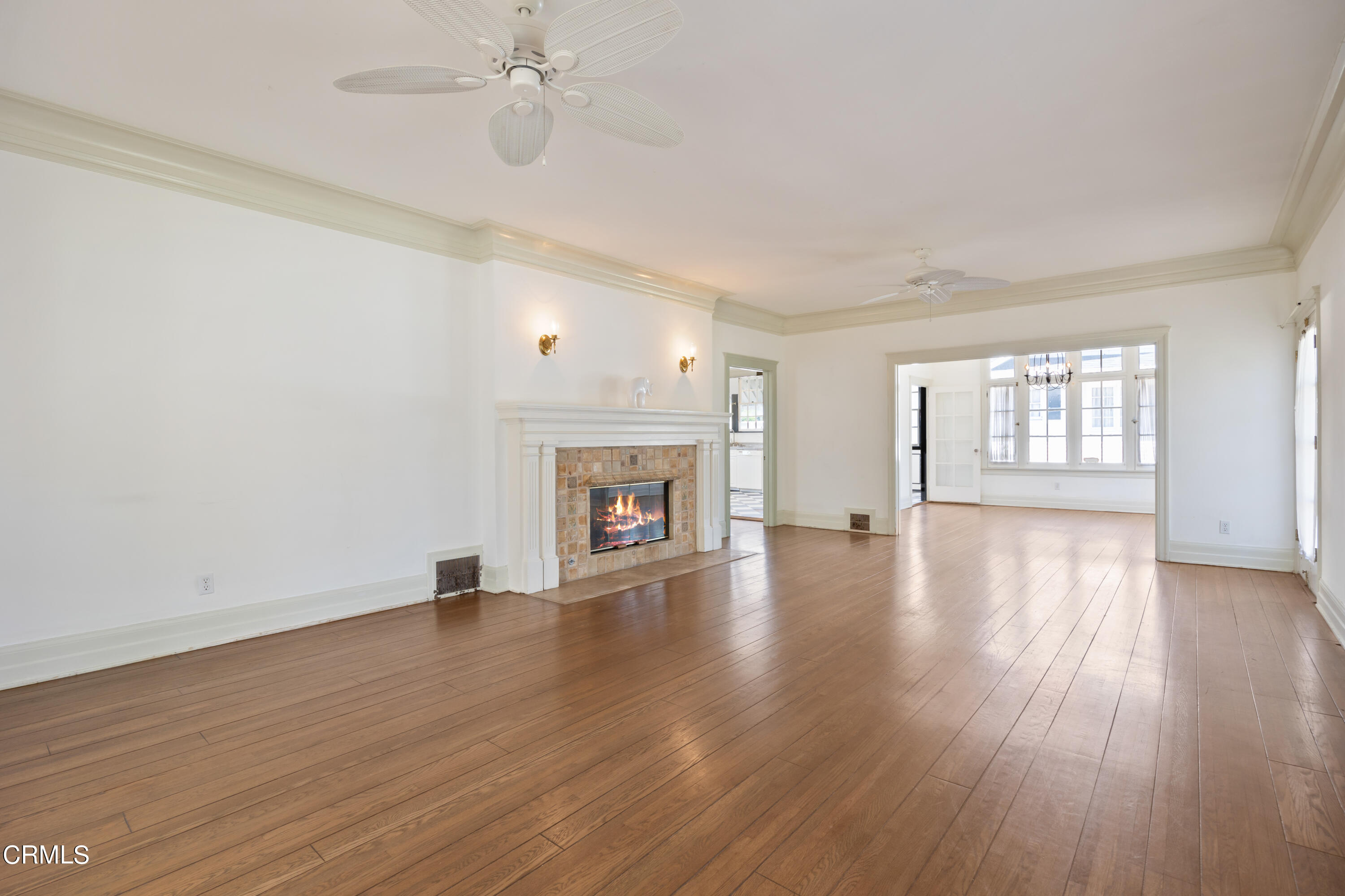 430 West Kenneth Road Glendale, CA 91202 - Photo 8 of 73 an empty room with wooden floor fireplace and windows