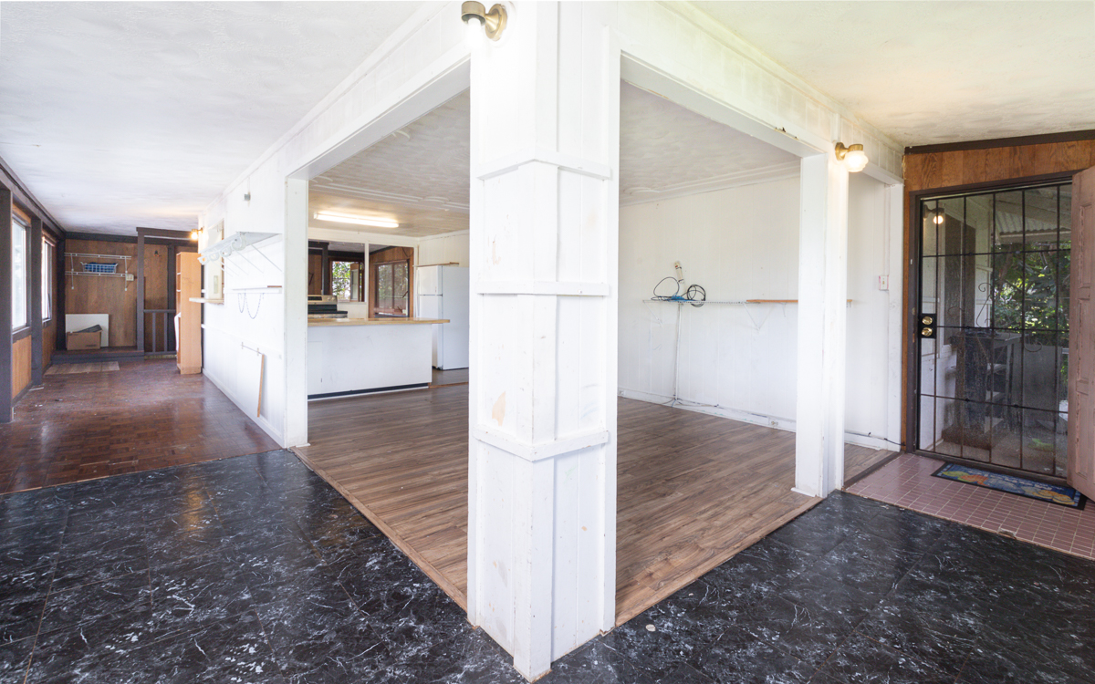 17-251 Volcano Road Keaau, HI 96749 - Photo 4 of 28 a view of a hallway view with wooden floor and staircase