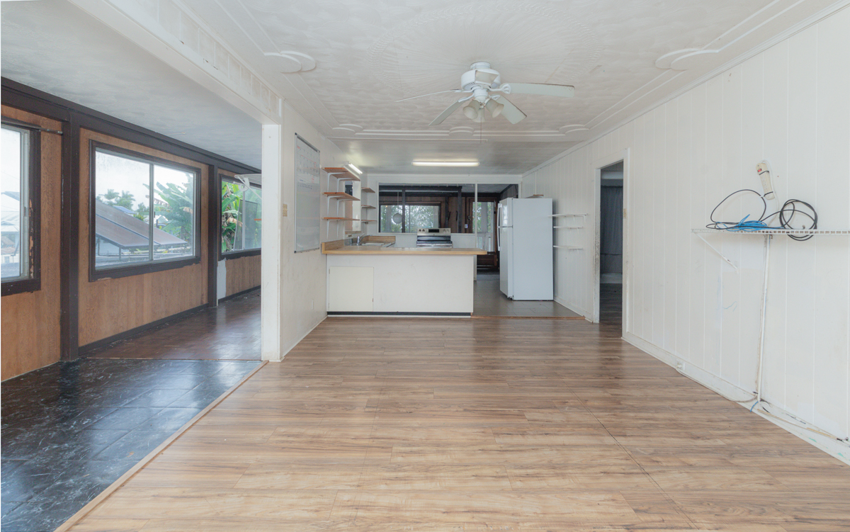 17-251 Volcano Road Keaau, HI 96749 - Photo 5 of 28 a view of a kitchen with a stove cabinets and wooden floor