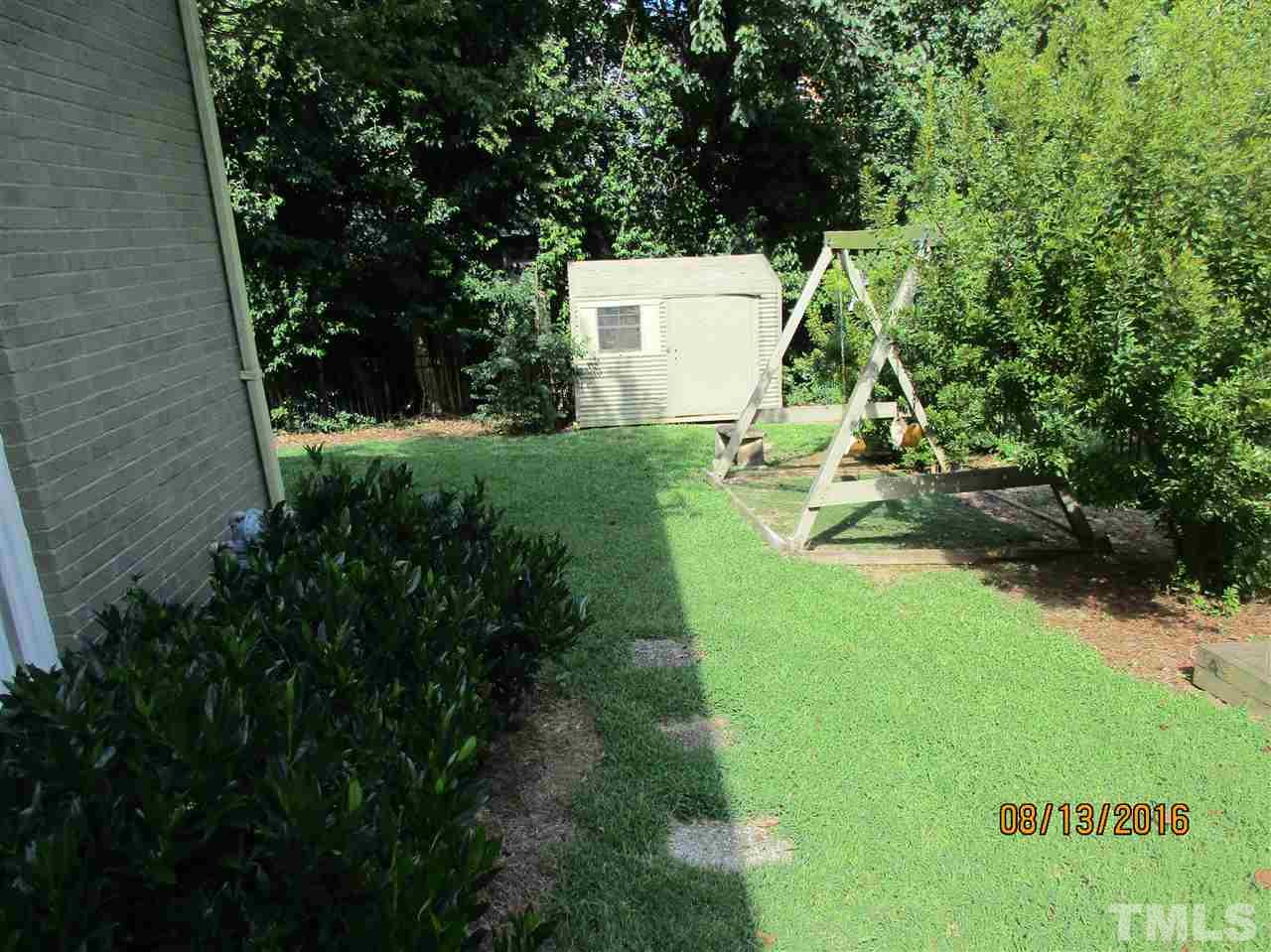1642 Bickett Boulevard Raleigh, NC 27608 - Photo 3 of 25 a view of a back yard of the house