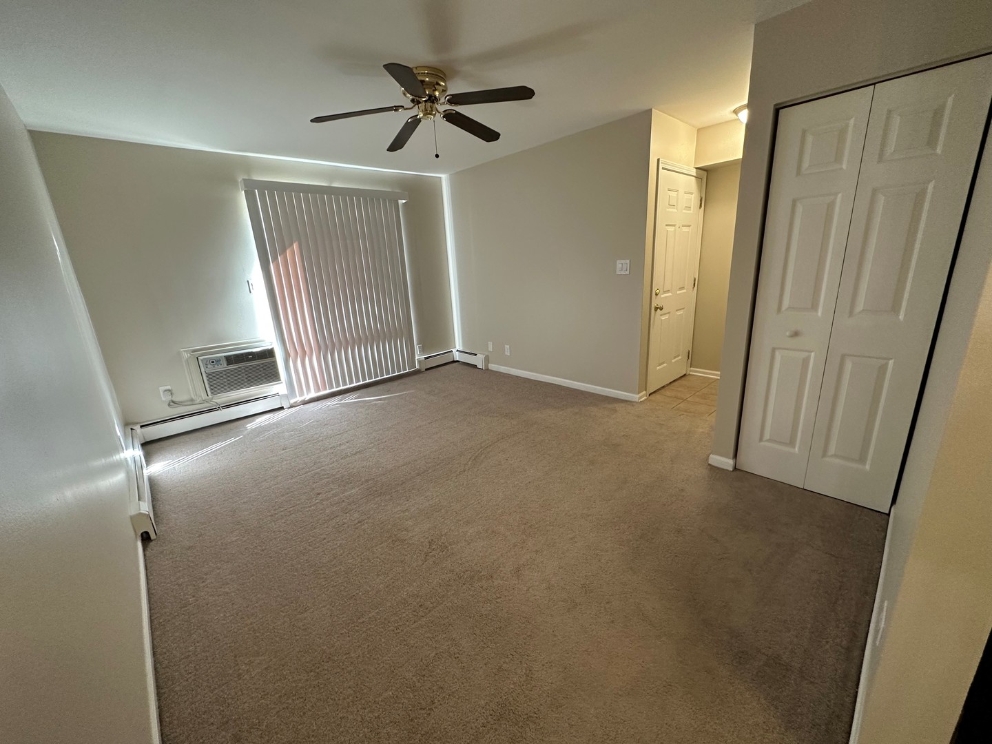 2100 Light Road, Unit 108 Oswego, IL 60543 - Photo 2 of 12 a view of empty room with wooden floor