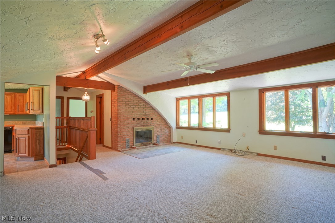 4141 Dudley Road Mantua, OH 44255 - Photo 32 of 35 Living area with wood burning fireplace.