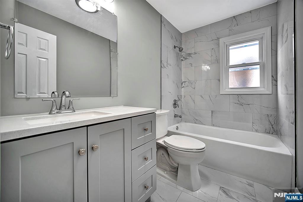 509 Grove Street Bloomfield, NJ 07017 - Photo 14 of 29 a bathroom with a sink toilet and shower