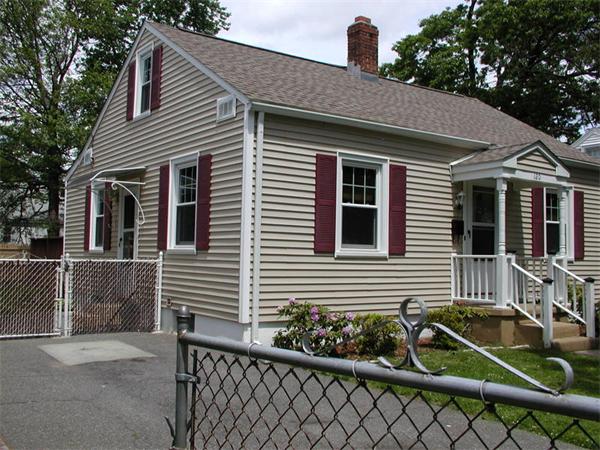 120 Merida Street Springfield, MA 01104 - Photo 1 of 24 a front view of a house with plants