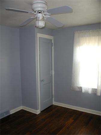 120 Merida Street Springfield, MA 01104 - Photo 11 of 24 a view of an empty room with wooden floor and a window