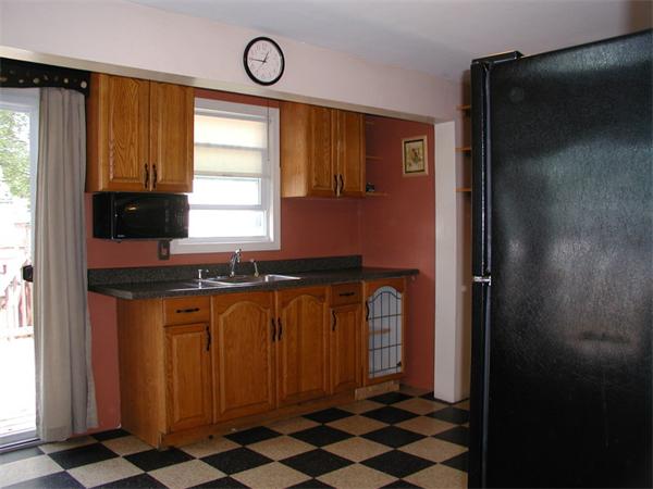 120 Merida Street Springfield, MA 01104 - Photo 8 of 24 a kitchen with stainless steel appliances a refrigerator and a stove top oven