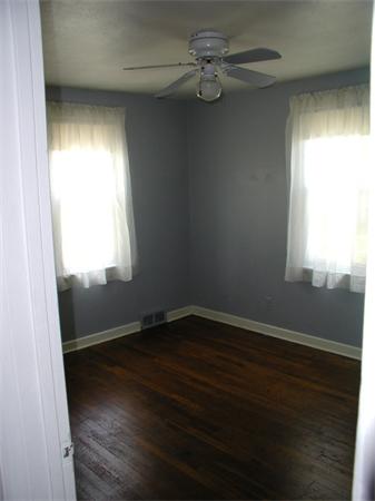 120 Merida Street Springfield, MA 01104 - Photo 10 of 24 an empty room with wooden floor and windows