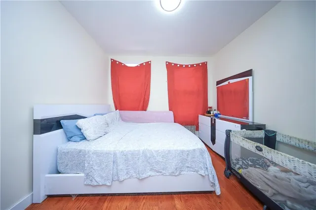 a bedroom with a bed and window