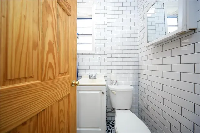 a bathroom with a toilet and a sink