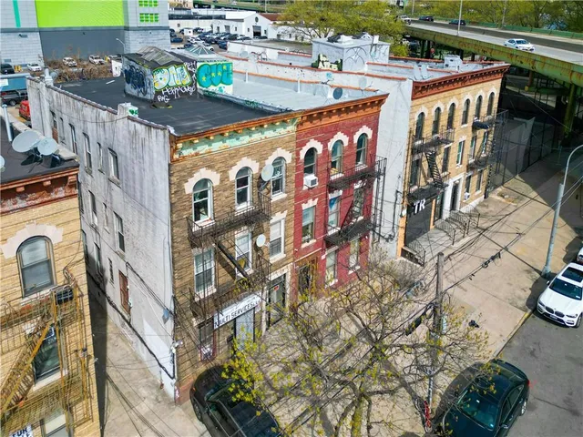 an aerial view of residential houses with stairs