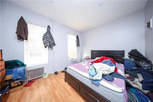 a bed room with furniture and a window