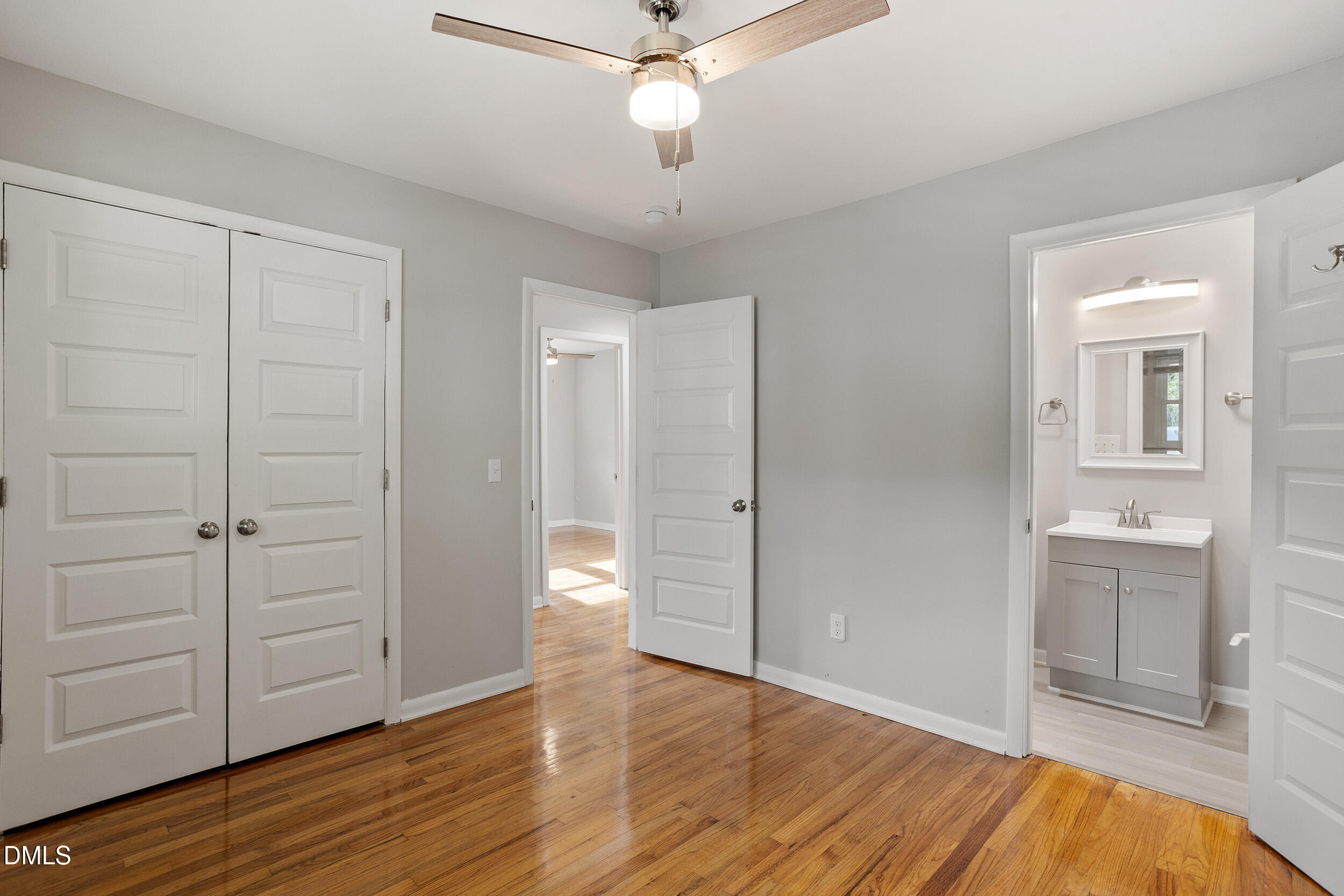 2414 Chapin Street Durham, NC 27707 - Photo 21 of 30 an empty room with wooden floor cabinet and windows