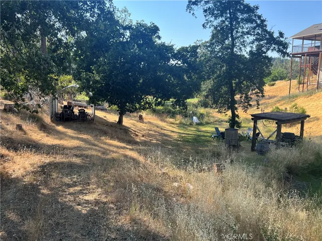 a view of a yard with patio
