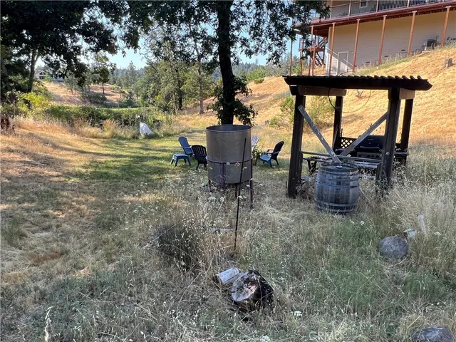 a backyard of a house with table and chairs