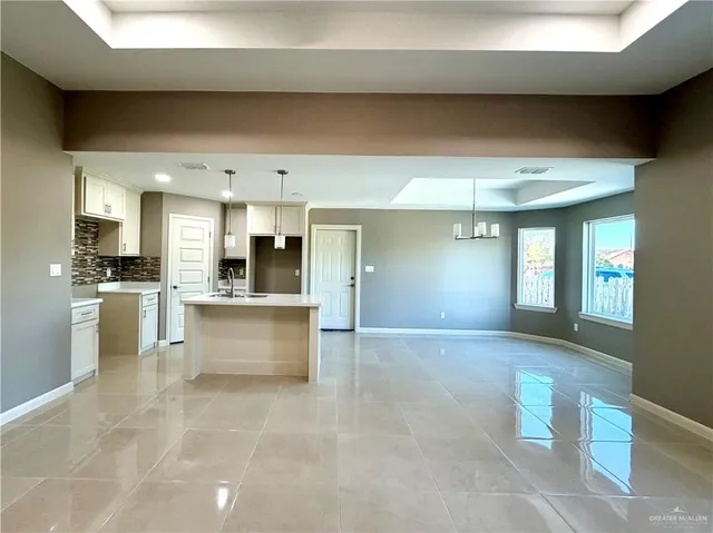 a view of large kitchen with cabinets