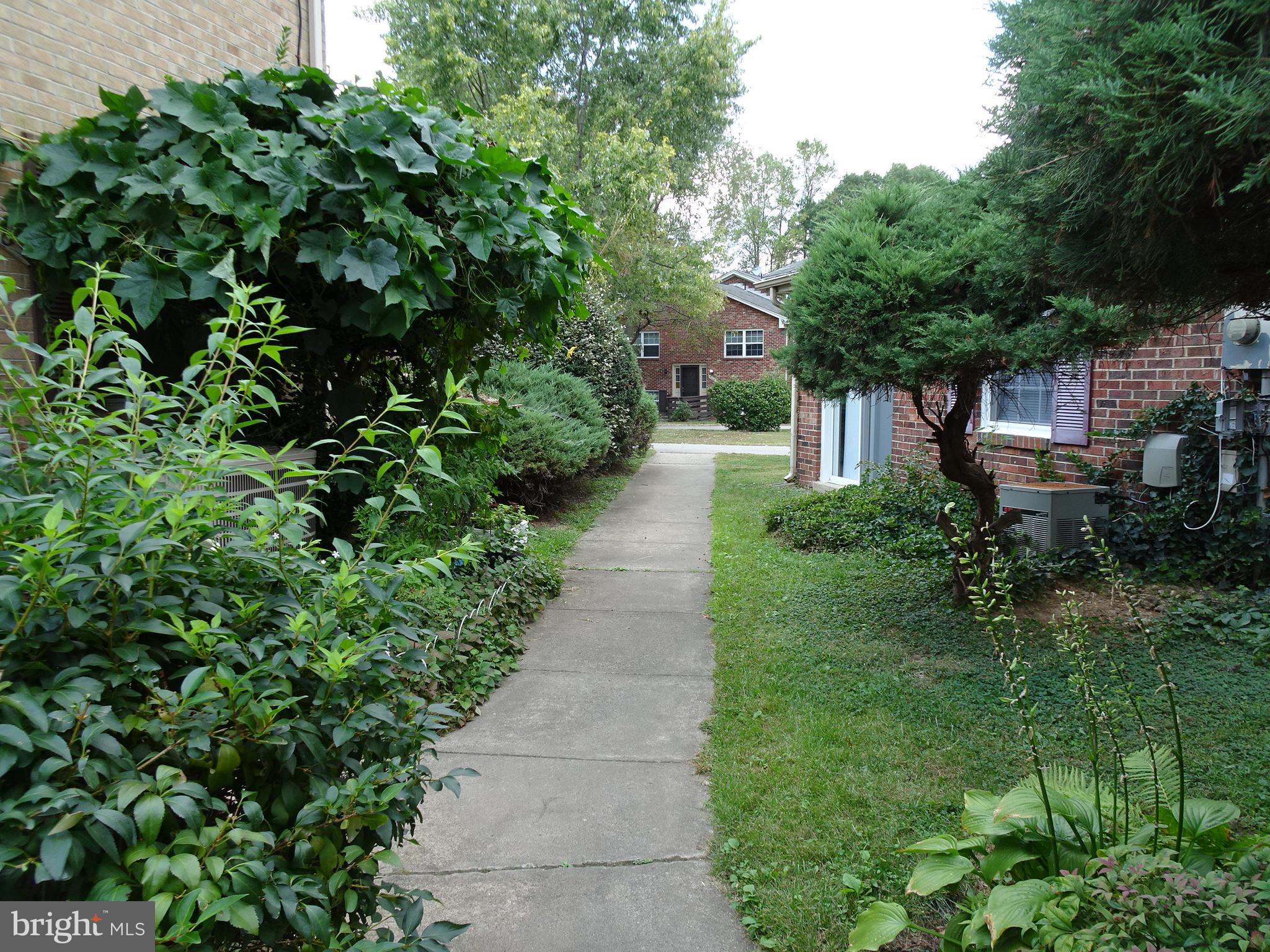 9746 Hagel Circle, Unit E Lorton, VA 22079 - Photo 14 of 18 Lush landscaping around complex
