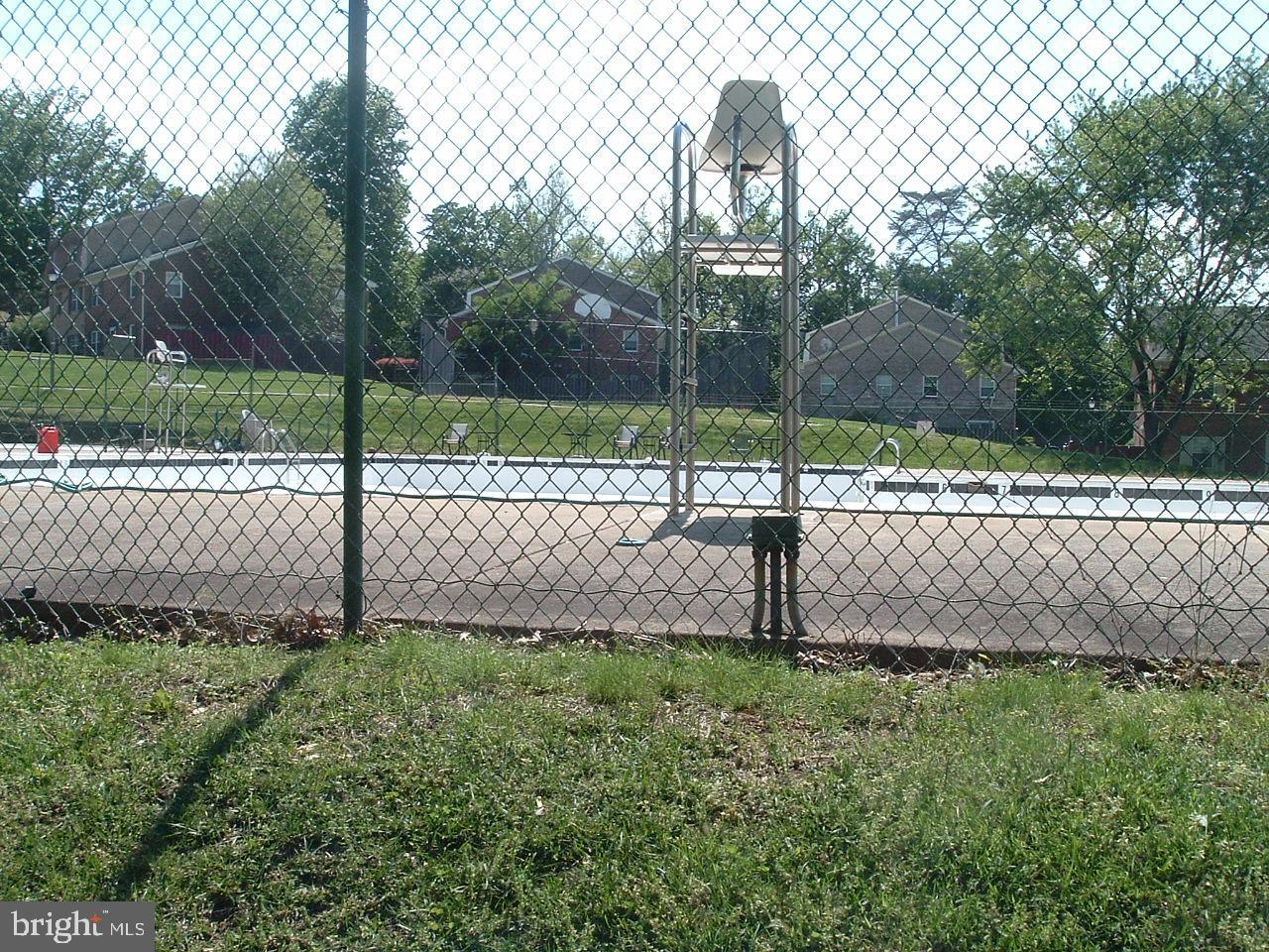 9746 Hagel Circle, Unit E Lorton, VA 22079 - Photo 17 of 18 Fenced in Pool with lifeguard