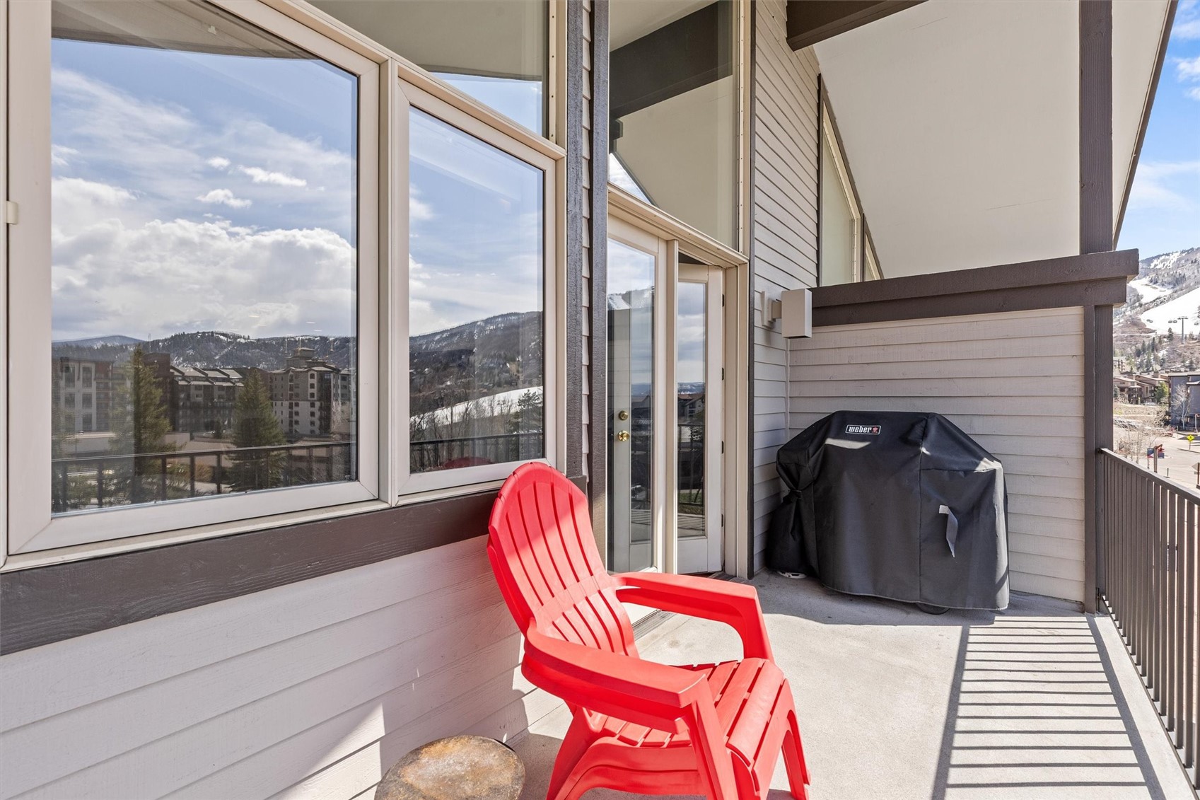 1724 Ski Time Square Drive, Unit R6 Steamboat Springs, CO 80487 - Photo 34 of 39 a view of a balcony with chair and the potted plant