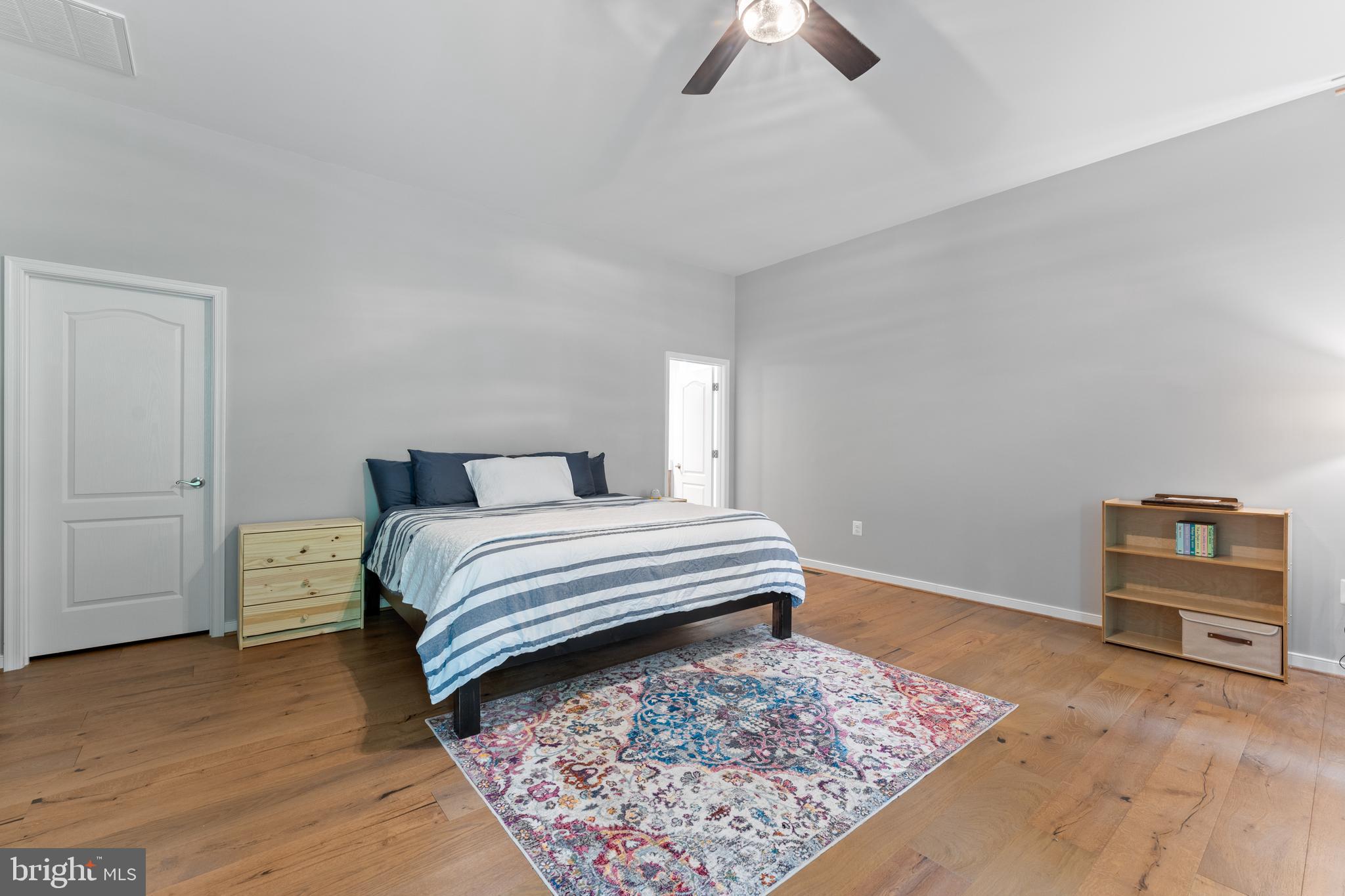 80 Shackelford Well Road Fredericksburg, VA 22406 - Photo 10 of 108 a bedroom with a bed and a chandelier