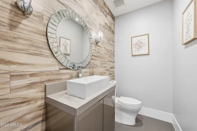 a bedroom with bed and a potted plant