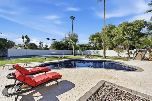 a view of swimming pool with a yard