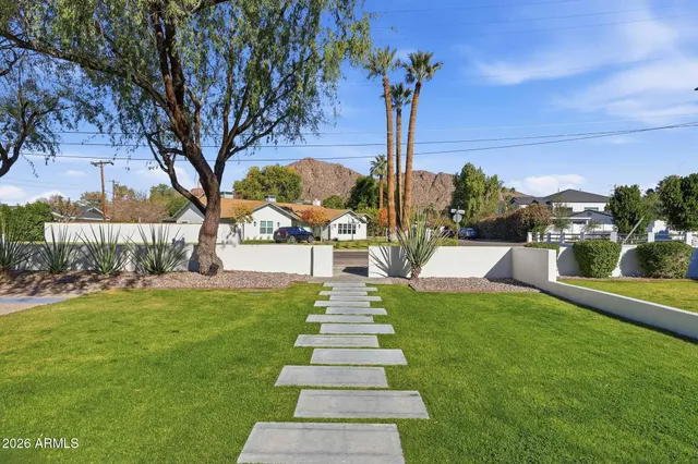 a view of a garden with swimming pool