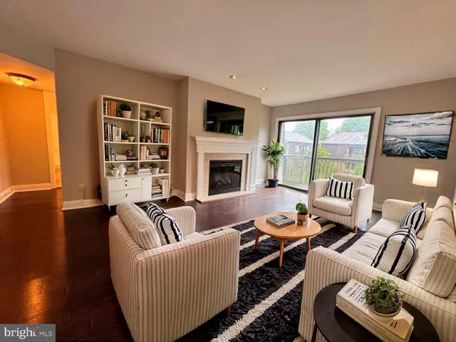 a living room with furniture fireplace and a flat screen tv