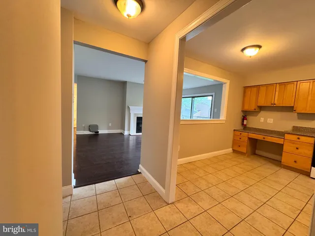a view of a kitchen with a sink and cabinets