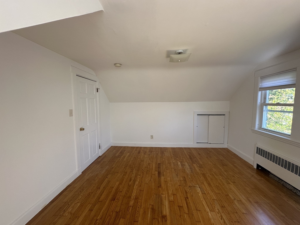 206 Adams Street, Unit 206 Newton, MA 02458 - Photo 22 of 37 a view of a room with wooden floor and window