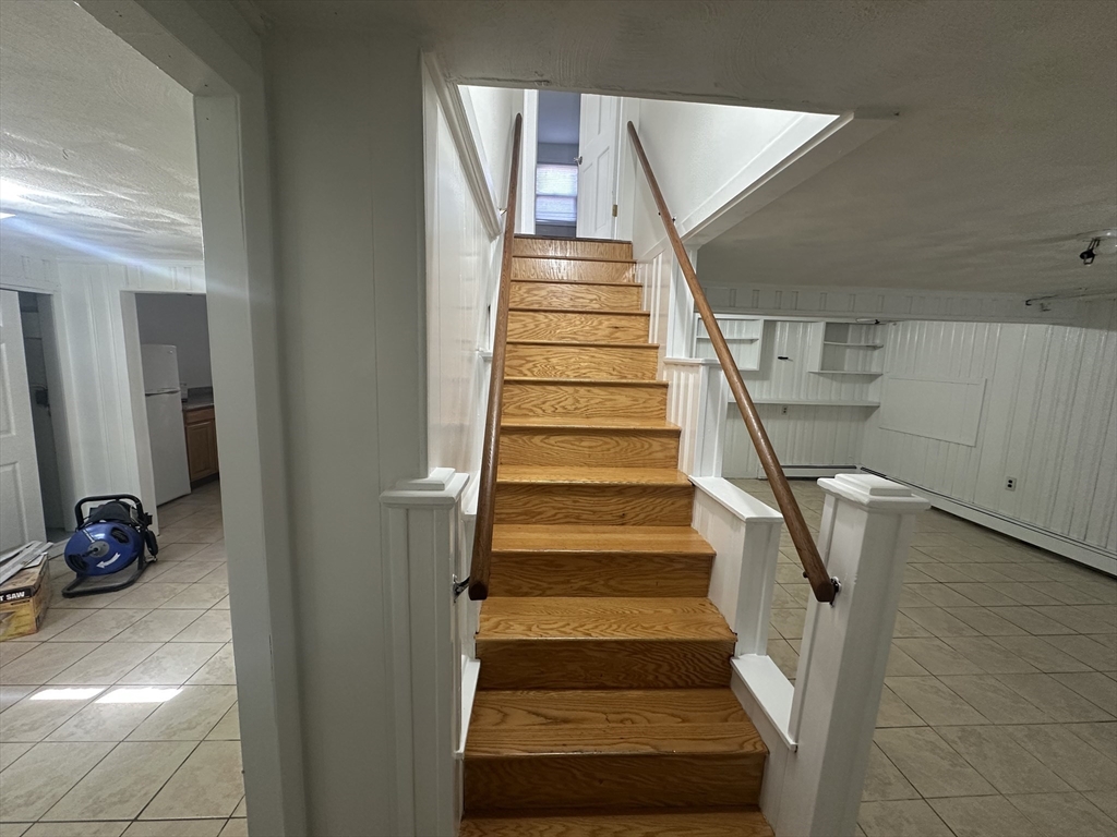 206 Adams Street, Unit 206 Newton, MA 02458 - Photo 26 of 37 a view of entryway and hall with wooden floor