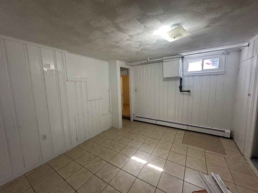 206 Adams Street, Unit 206 Newton, MA 02458 - Photo 31 of 37 a view of an empty room and window of bathroom