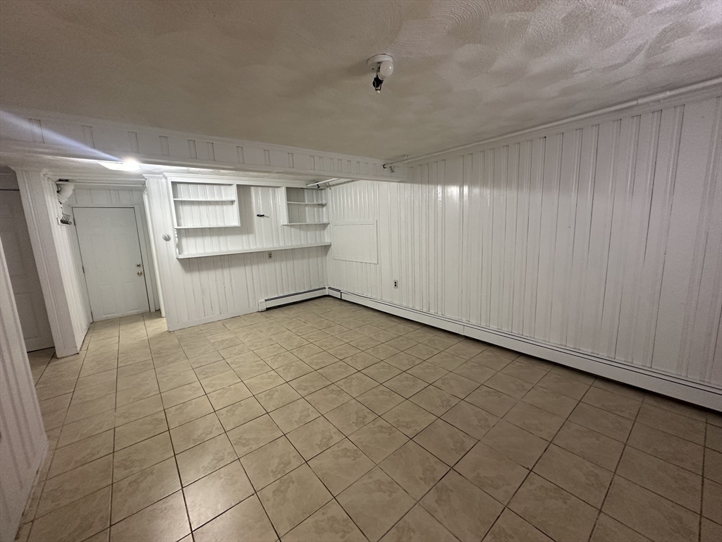 206 Adams Street, Unit 206 Newton, MA 02458 - Photo 32 of 37 a view of a kitchen with white walls and white appliances