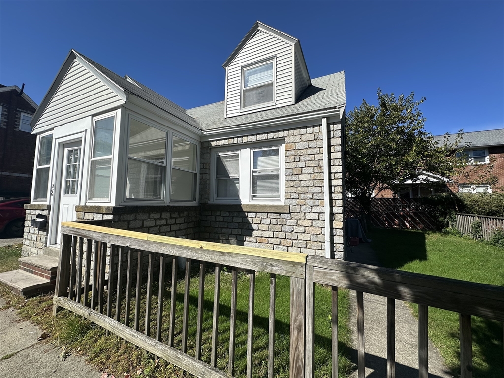 206 Adams Street, Unit 206 Newton, MA 02458 - Photo 36 of 37 a view of a house with a yard