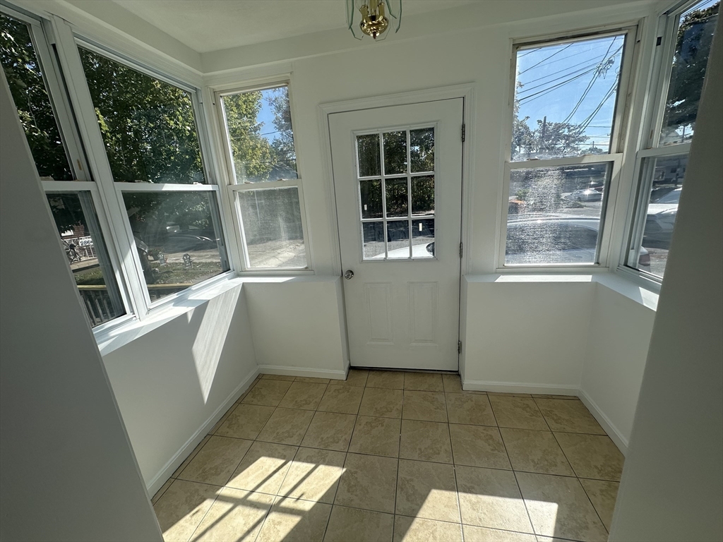 206 Adams Street, Unit 206 Newton, MA 02458 - Photo 5 of 37 a view of an empty room with a window