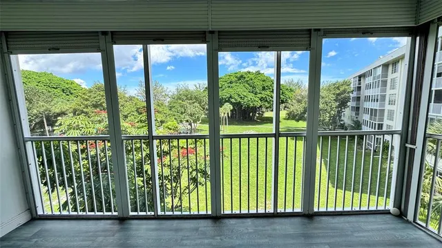 a view of a porch with a floor to ceiling window