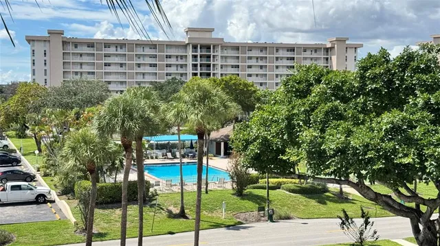a view of a tall building from a bench
