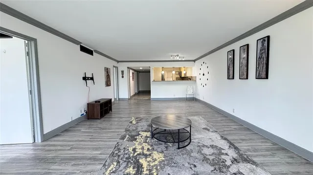 a view of a entryway door with wooden floor
