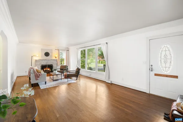 a view of a dining room with furniture wooden floor and chandelier