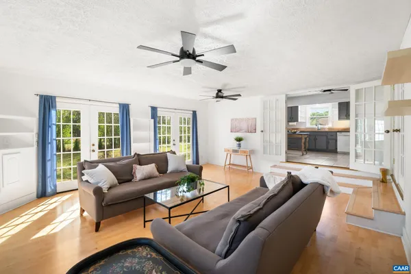 a kitchen with stainless steel appliances granite countertop a sink a stove and a refrigerator