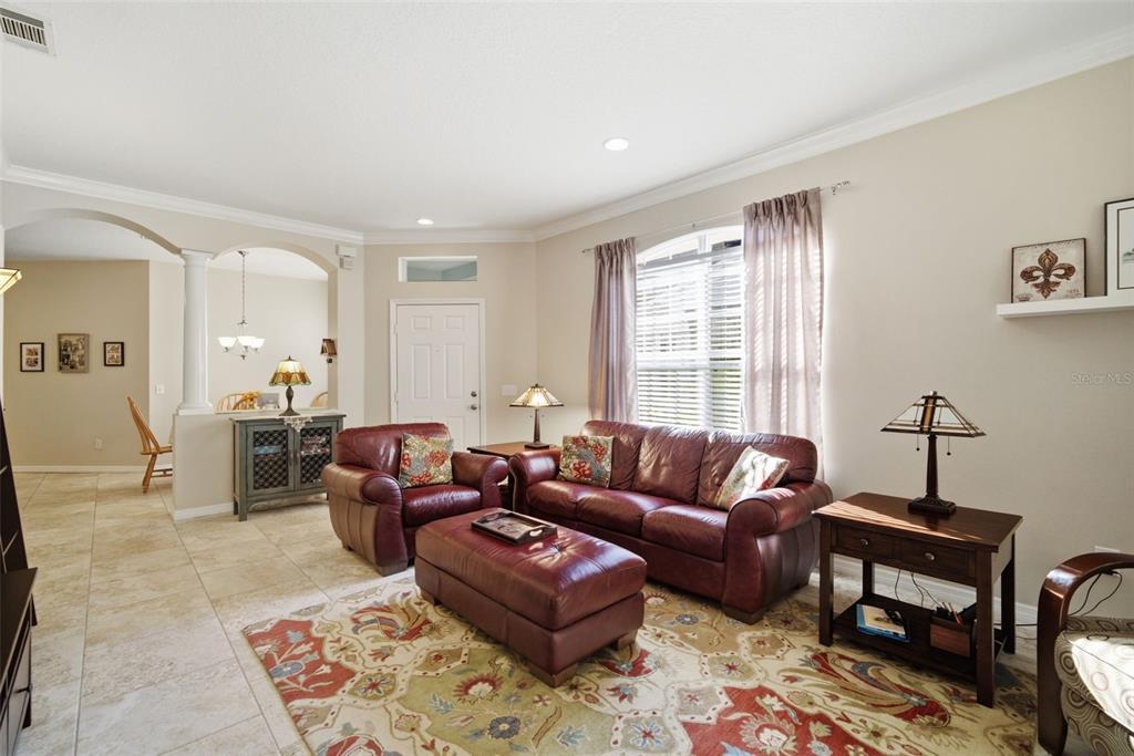 6057 Sandhill Ridge Drive Lithia, FL 33547 - Photo 11 of 83 a living room with furniture and a window