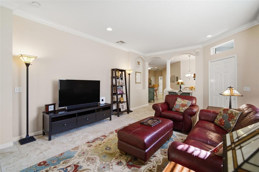 6057 Sandhill Ridge Drive Lithia, FL 33547 - Photo 12 of 83 a living room with furniture and a flat screen tv