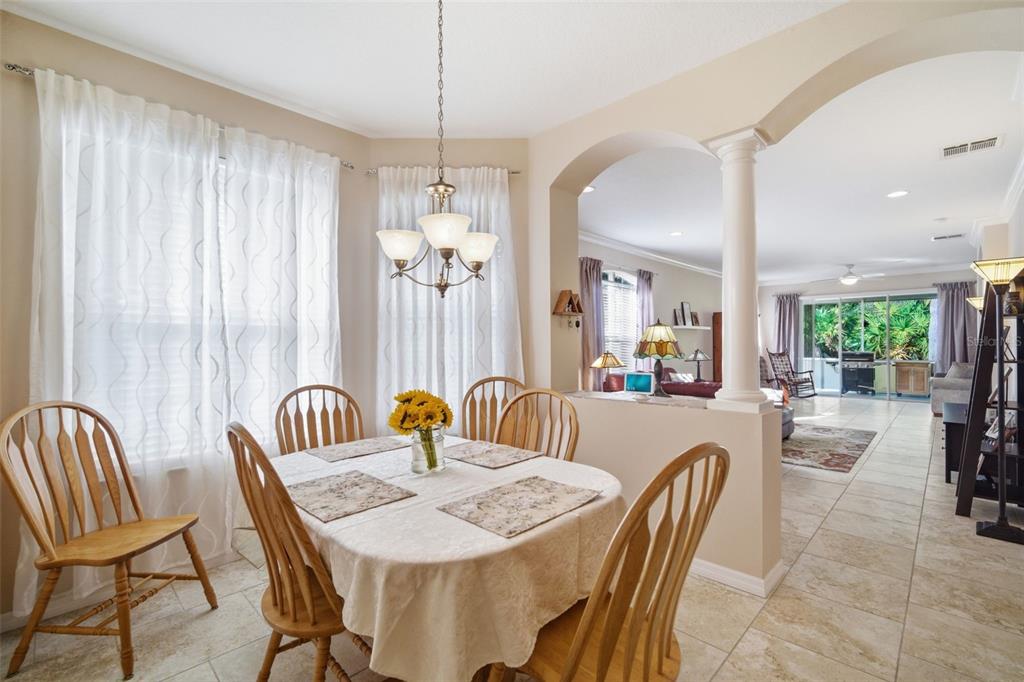 6057 Sandhill Ridge Drive Lithia, FL 33547 - Photo 18 of 83 a view of a dining room with furniture window and outside view