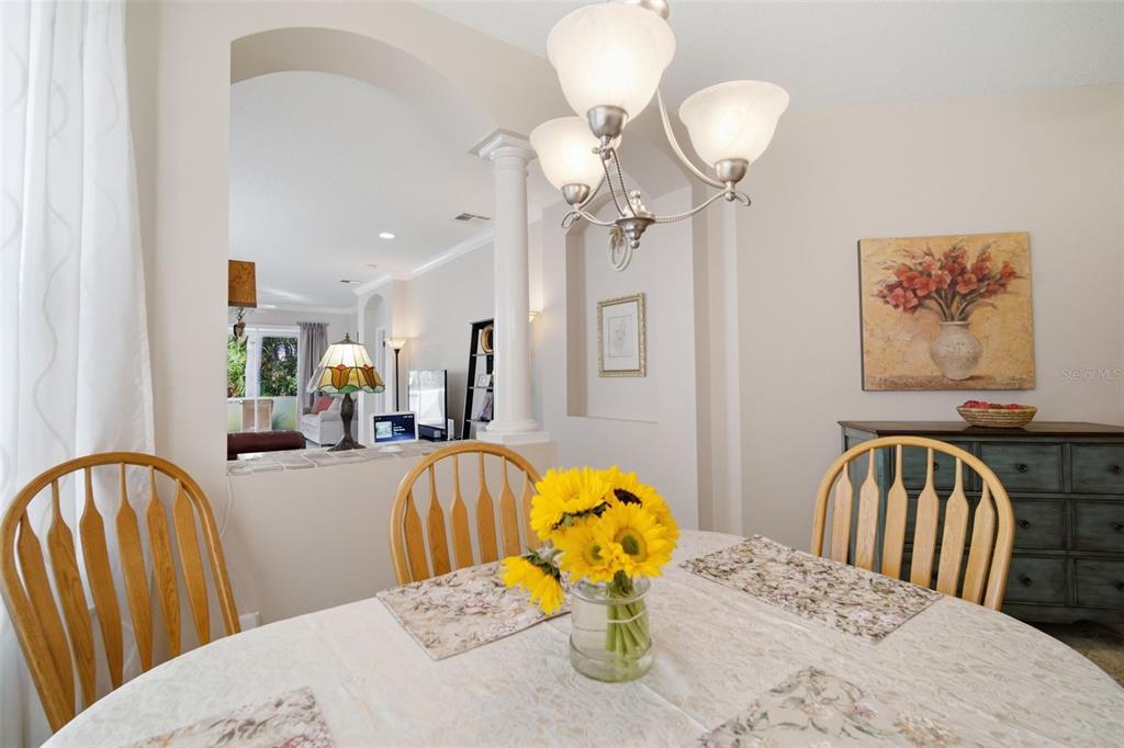 6057 Sandhill Ridge Drive Lithia, FL 33547 - Photo 20 of 83 a view of a dining room with furniture and chandelier