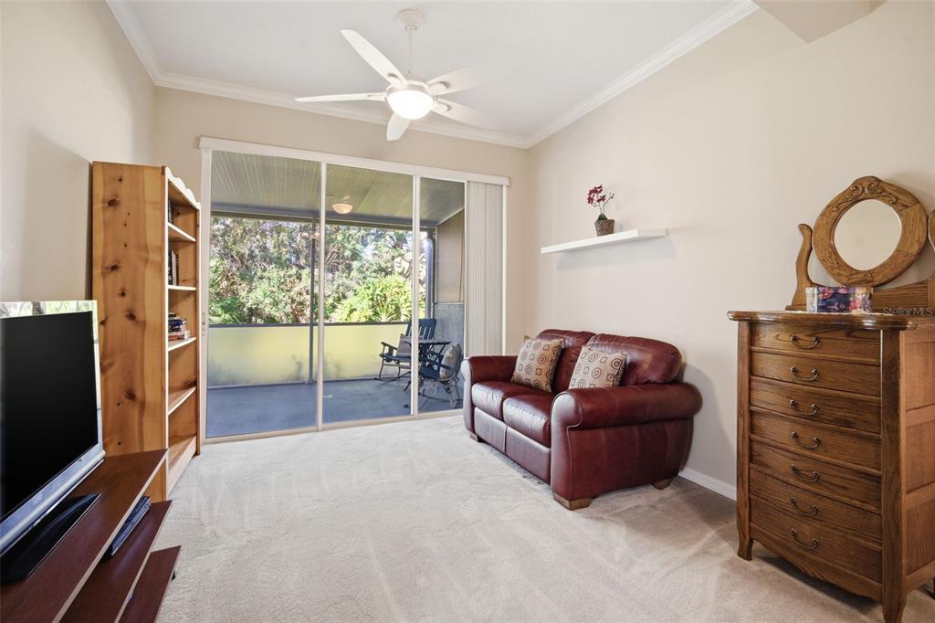 6057 Sandhill Ridge Drive Lithia, FL 33547 - Photo 22 of 83 a living room with furniture and a flat screen tv