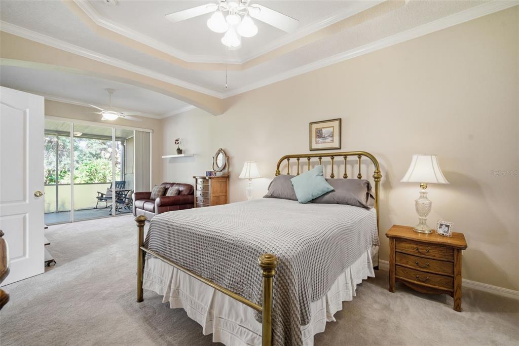 6057 Sandhill Ridge Drive Lithia, FL 33547 - Photo 27 of 83 a bedroom with a bed and a large window